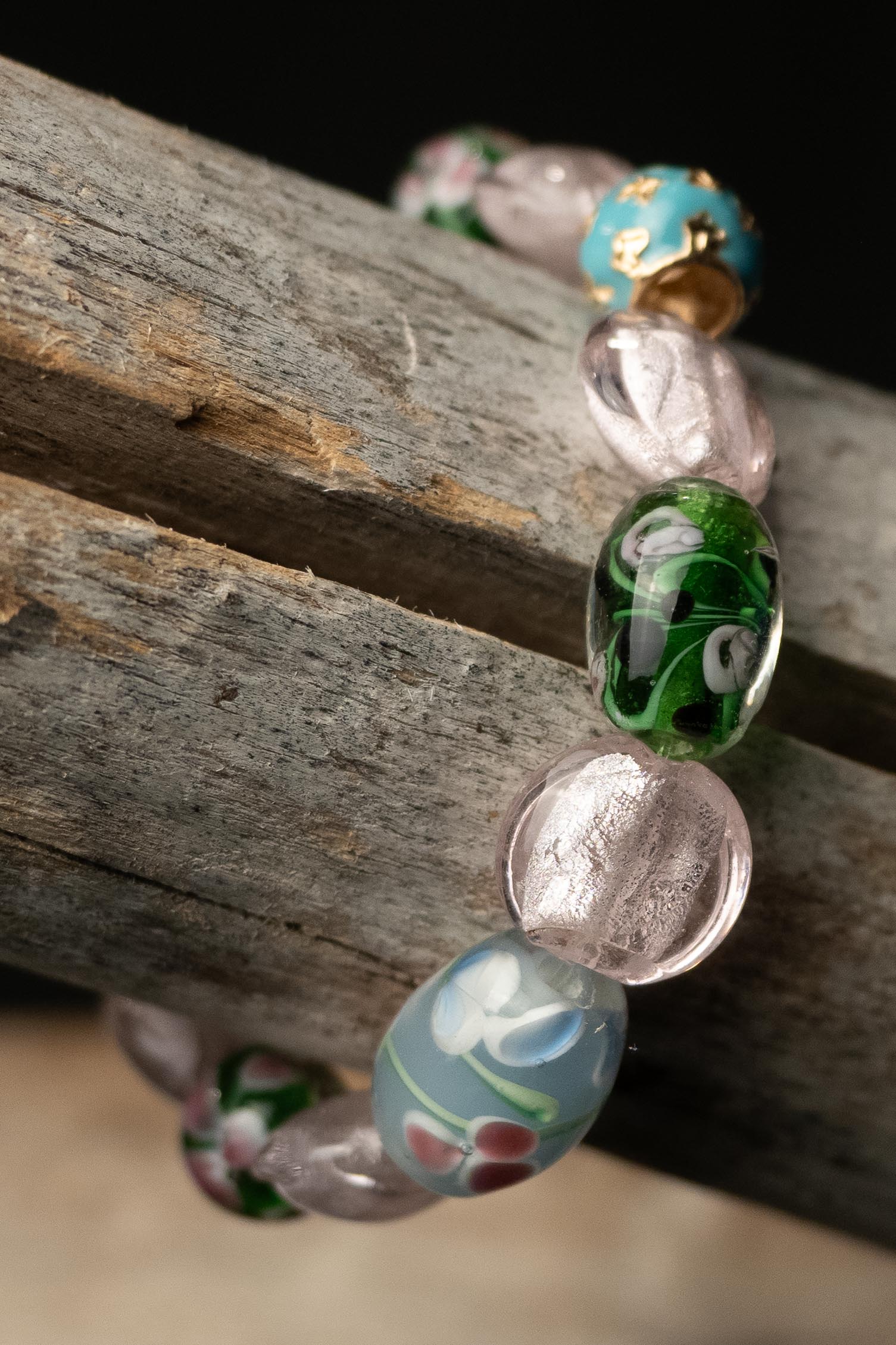 Colorful beaded bracelet on a wooden surface