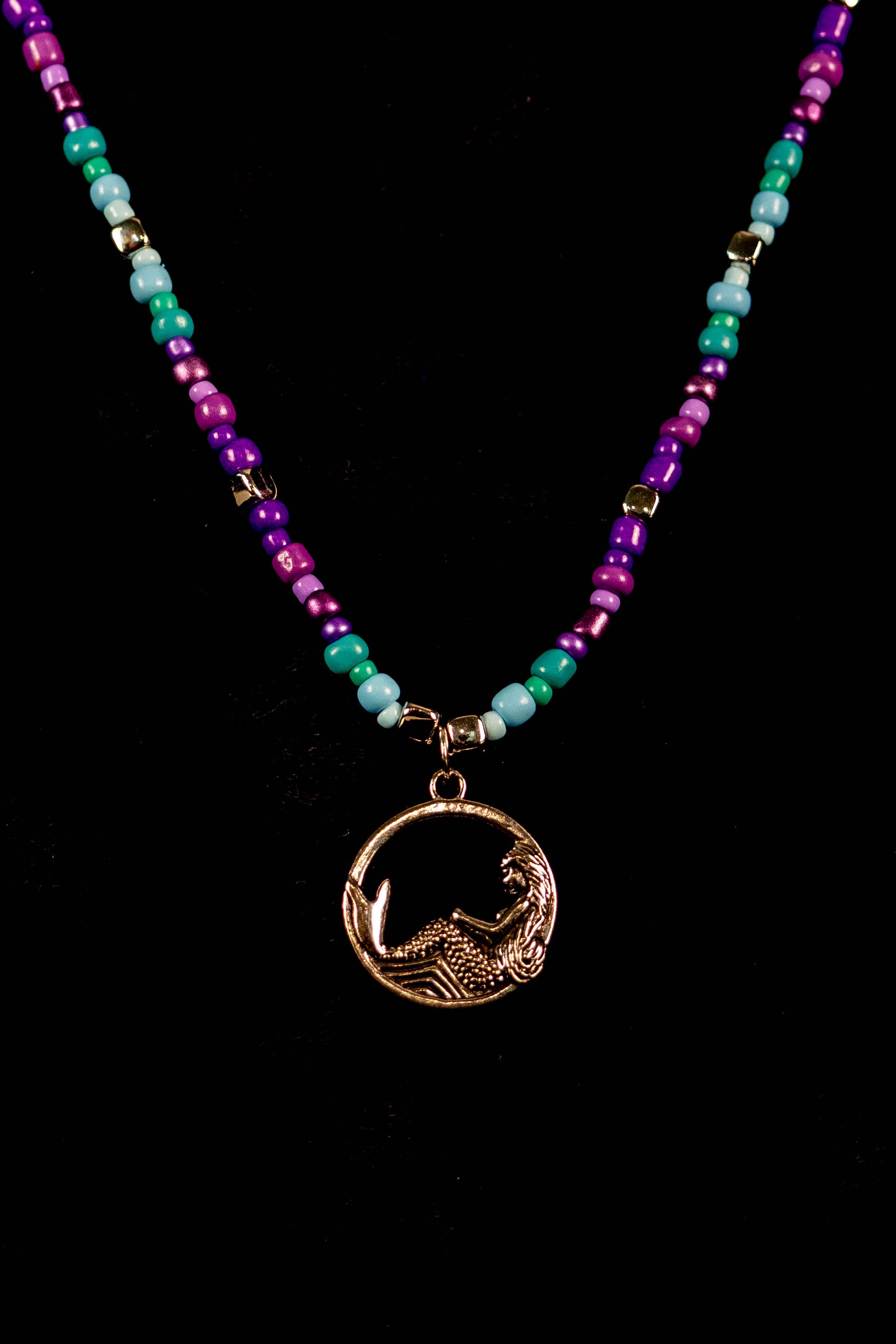 Andie handcrafted turquoise purple blue and silver beaded necklace on black velvet surface — Amelia Heir Art