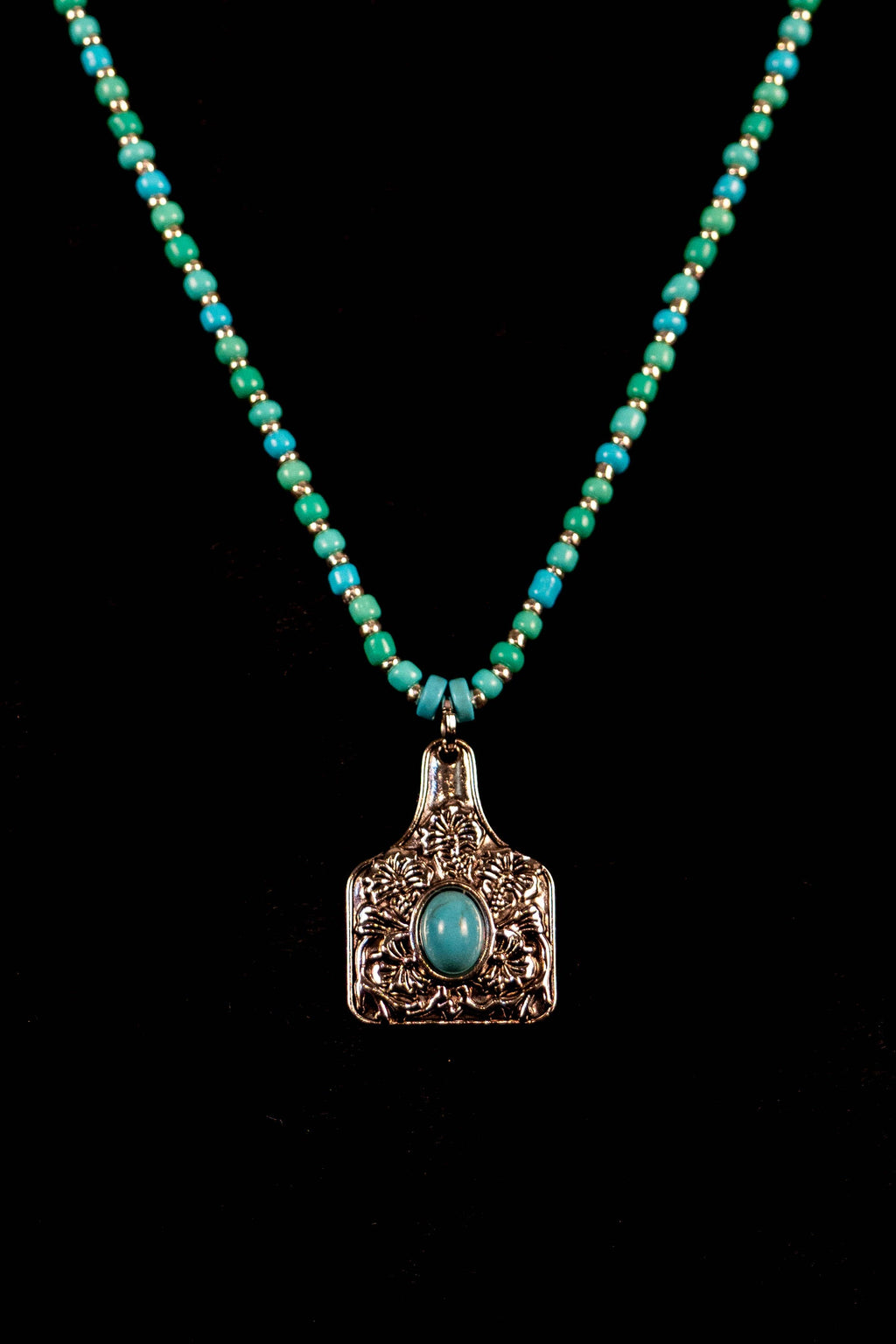 Cortnie handcrafted turquoise & silver beaded necklace with cowgirl chaps pendant — Amelia Heir Art