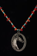 Necklace with a horse pendant and colorful beads on a black background