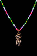 Necklace with colorful beads and a silver wildflower in a mason jar pendant on a black background