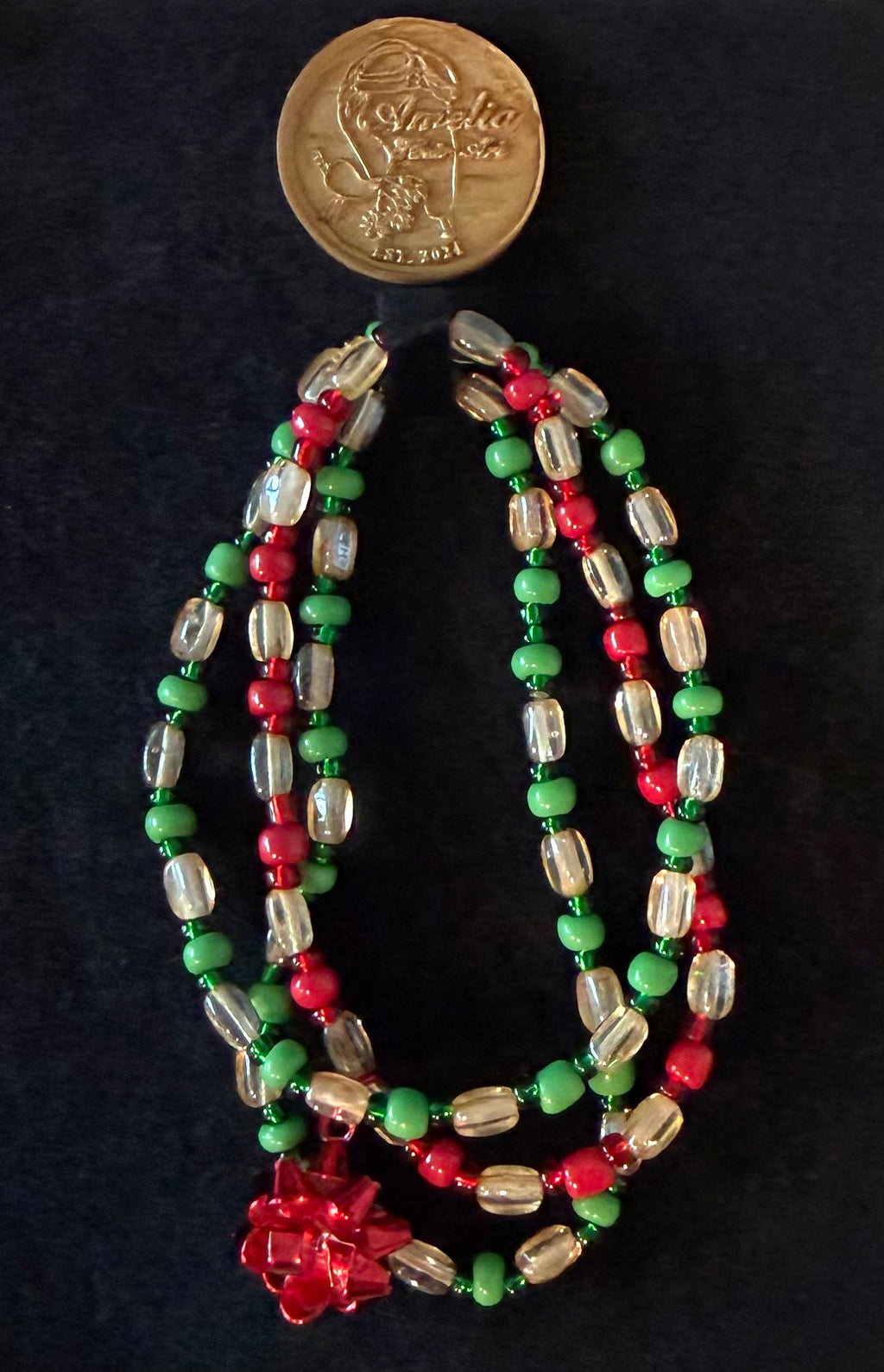 Present handcrafted red, green & ivory Christmas beaded bracelet with red gift bow charm — Amelia Heir Art
