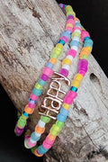 Colorful florescent beaded bracelet with 'Happy' charm on a wooden surface