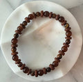 Kelly beaded bracelet, tiger eye, dyed coconut shell, and glass Amelia Heir Art 