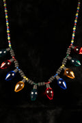 Necklace with colorful light bulb-shaped beads on a black background