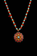 Necklace with colorful beads and a floral pendant on a black background