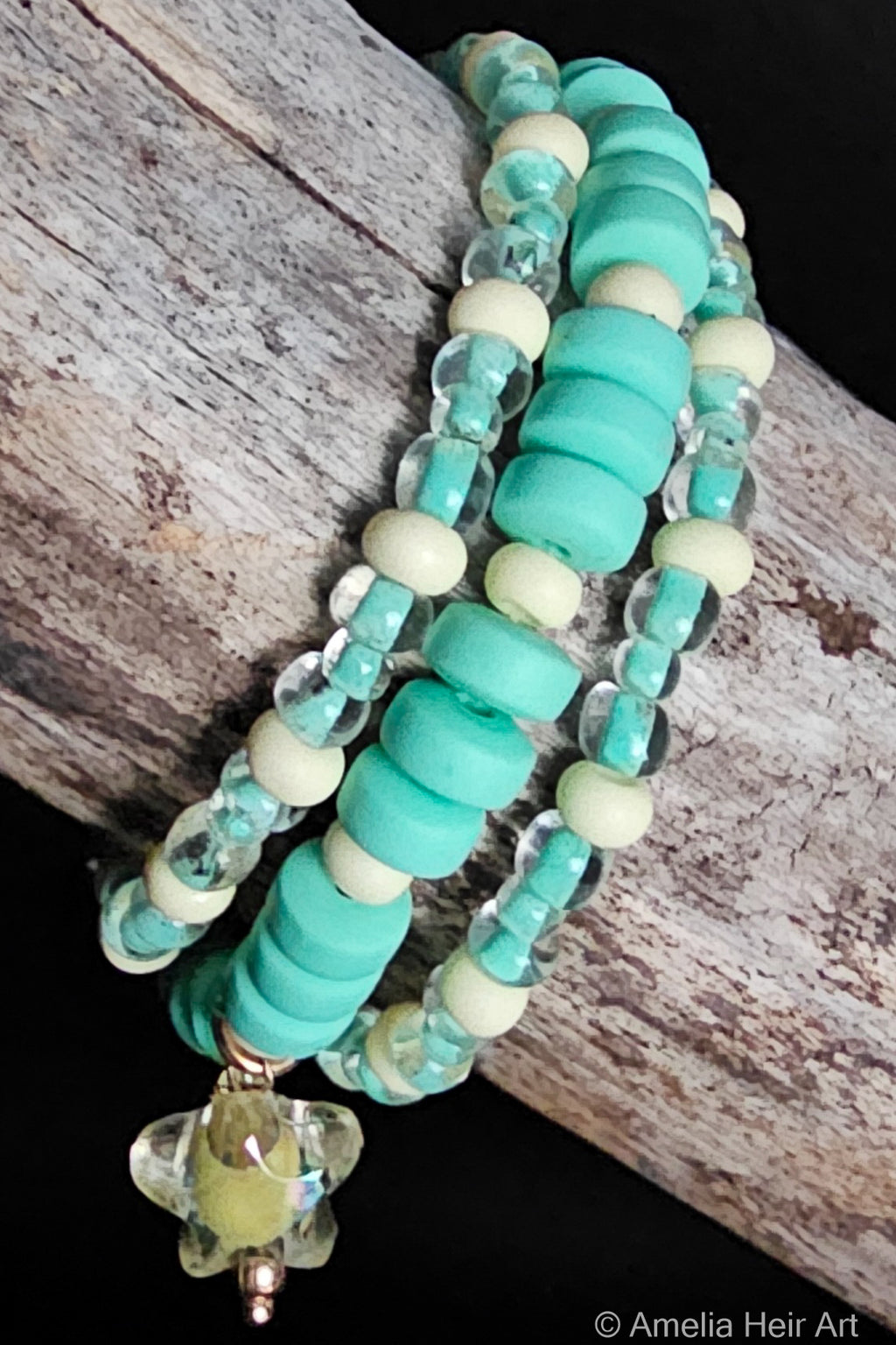 Olivia handcrafted yellow and green beaded bracelet set with star charm on a wooden surface — Amelia Heir Art