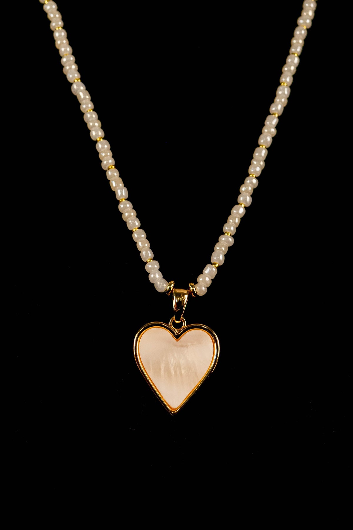 Opal handmade beaded necklace with white and gold beads, heart accent, and stretchy clasp-free cord, Amelia Heir Art Designs
