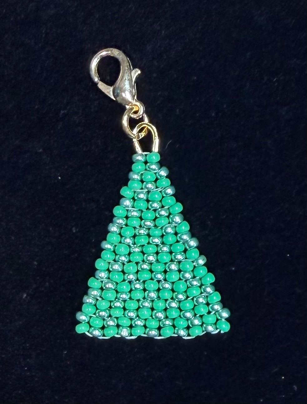Christmas Pine handmade zipper pull by Amelia Heir Art, featuring green and metallic green beads in a pine tree shape with a lobster clasp.
