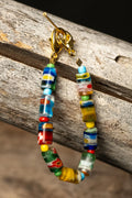 Colorful beaded chain on a wooden surface