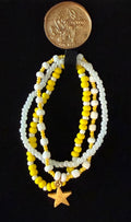 Shine beaded bracelet set with yellow and white beads and a gold star charm — handmade jewelry by Amelia Heir Art Designs