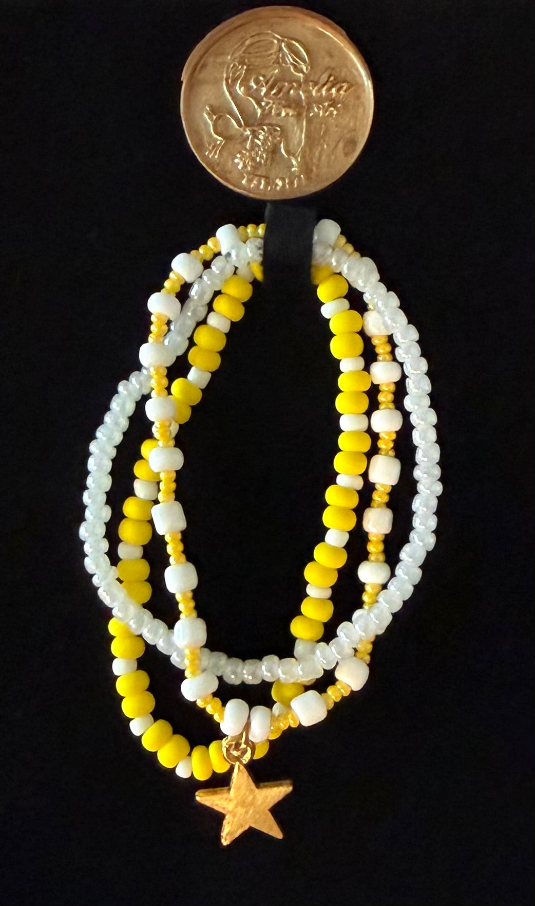 Shine beaded bracelet set with yellow and white beads and a gold star charm — handmade jewelry by Amelia Heir Art Designs