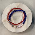 Americana Collection, 250 Anniversary, three red, white, and blue beaded bracelets with 'USA' and 250 numbers on a marble circle, Amelia Heir Art